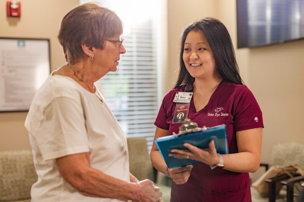 Vistar Eye Center employee shows a patient information on a clipboard